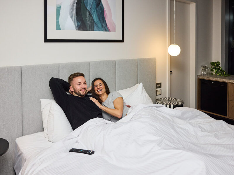 Couple in bed at Brady Hotels Elizabeth Street