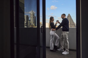 Couple on a hotel balcony in Melbourne
