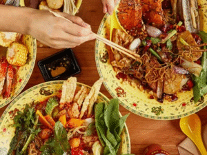 Colorful bowls of spicy hot pot with noodles, seafood, and vegetables at Dragon Hot Pot in Melbourne.