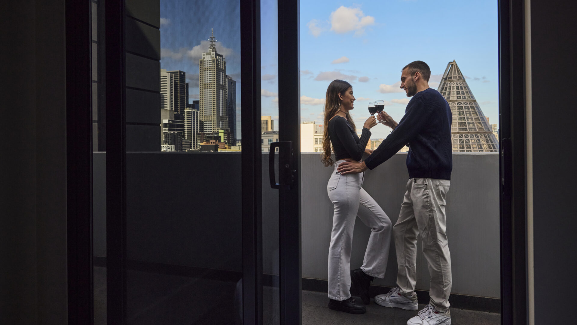 Couple on a hotel balcony in Melbourne