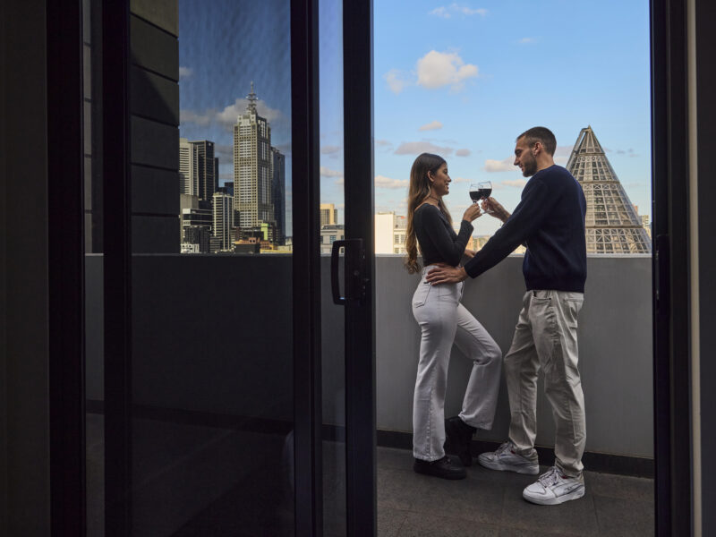 Couple on a hotel balcony in Melbourne