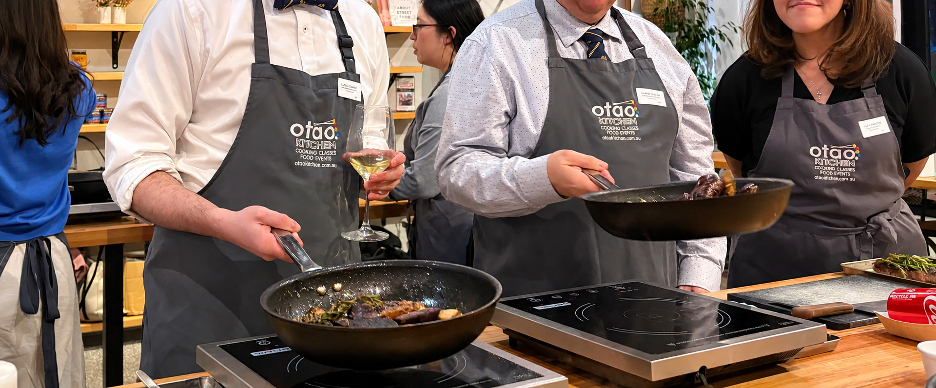 Guests enjoying a hands-on cooking class at Otao Kitchen in Melbourne